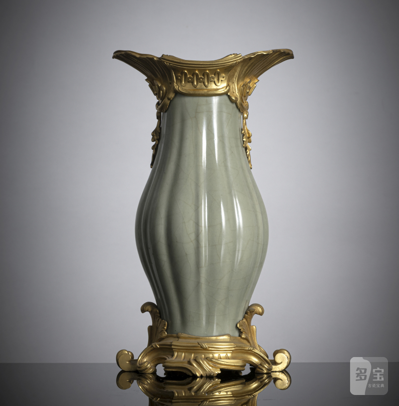 A ribbed porcelain celadon vase in a fine ormolu mount
